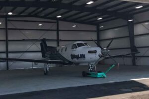 Image of an airplane in the newly completed hangar at the Fresno airport, a joint development project by Capital Rivers Commercial and SME Logistics, Inc., showcasing their expertise in commercial real estate development.