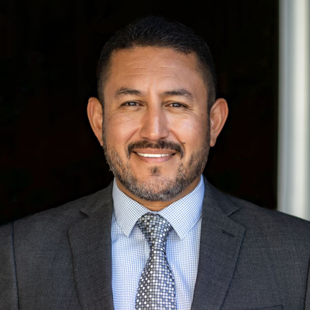Headshot of Juan Garcia, Director of Sales & Leasing at Capital Rivers Commercial, with expertise in the commercial real estate sector of Sacramento, CA. Pictured against a sleek office environment, Juan's confident and knowledgeable expression highlights his significant role in driving sales and leasing strategies for the vibrant commercial real estate market in Sacramento and the encompassing areas