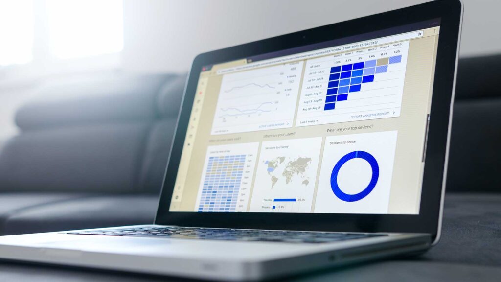 Computer screen displaying charts and graphs representing the complex factors and considerations in commercial real estate investments. Capital Rivers Commercial stands out in providing insights and guidance in the ever-changing market dynamics.