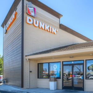 Front view of a Dunkin Donuts branch in Sacramento, captured during daytime, emblematic of the brand's vibrant identity. This branch represents another successful case study in commercial real estate, showcasing the effective strategies and insights offered by Capital Rivers Commercial in guiding top-tier franchise placements