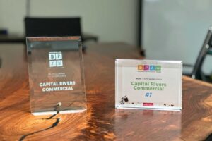 Image showcasing the 'Best Places to Work' award received by Capital Rivers, highlighting the company's excellence in fostering a positive and innovative workplace environment in the commercial real estate sector