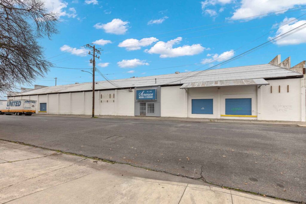 Image of a large warehouse spanning an entire city block, featuring ±20,000 SF of space and ±1,200 SF of climate-controlled office area. A prime Chico Commercial Sales Investment Opportunity.