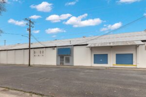 Image of a Chico industrial property that spans an entire city block and includes a ±20,000 square feet metal warehouse.