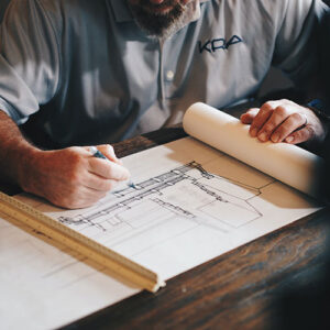 Image of architect drawing up Tenant Improvement Plans. Most commercial spaces will need additional improvements to suit the tenant’s business which needs to be addressed in the Commercial Leasing Agreements. 