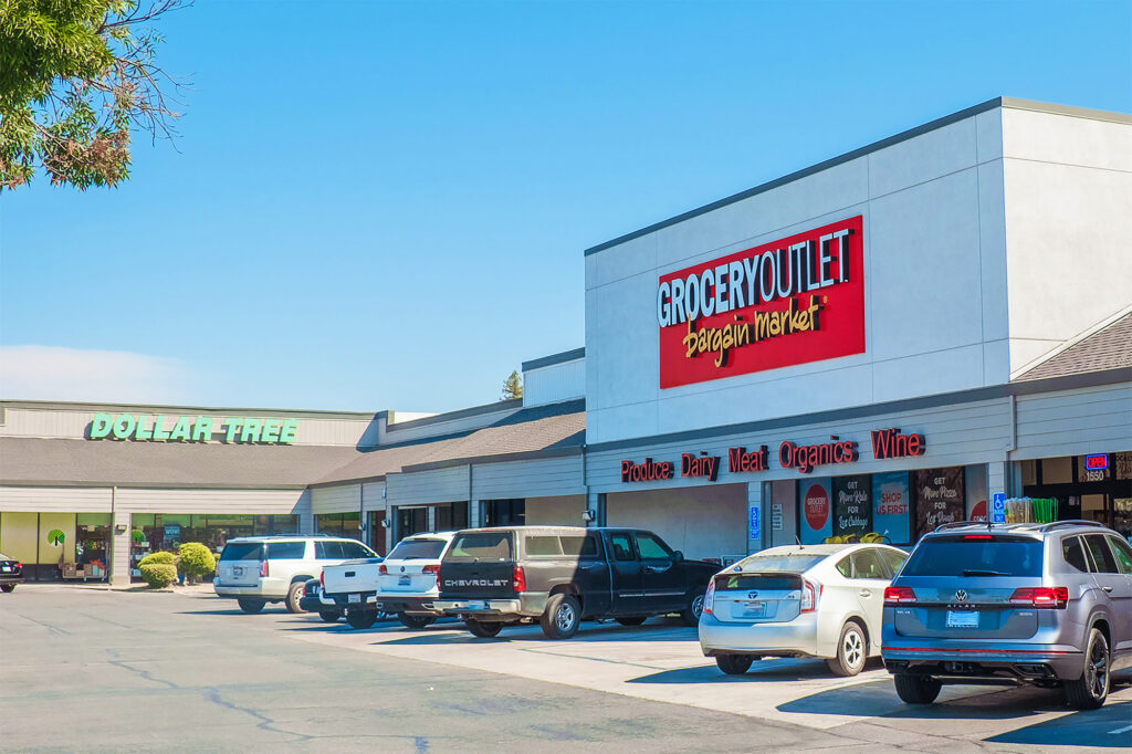 Busy Grocery Outlet parking lot reflecting how tariffs impact California retail markets