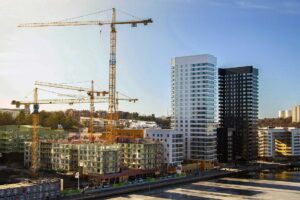 City development project with high-rises and crane, reflecting successful city development planning