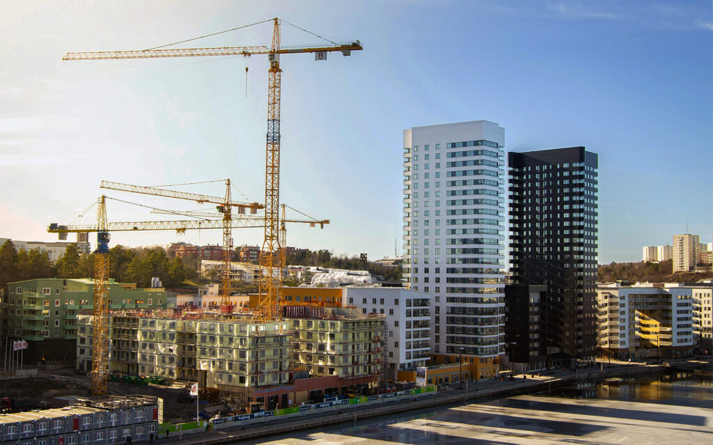 City development project with high-rises and crane, reflecting successful city development planning