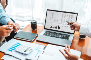 Financial team meeting evaluating commercial property value