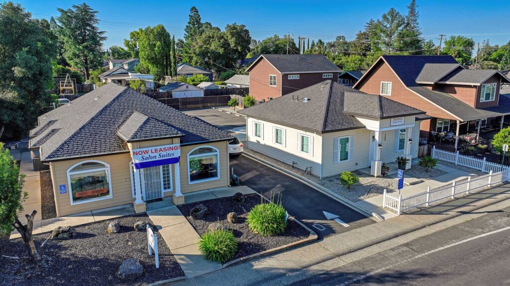 Two commercial retail buildings with landscaped grounds, illustrating the best commercial property investment opportunities in Northern California.