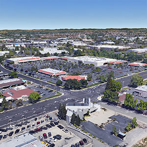 Aerial view of a suburban retail center and surrounding neighborhoods in the Sacramento suburbs.