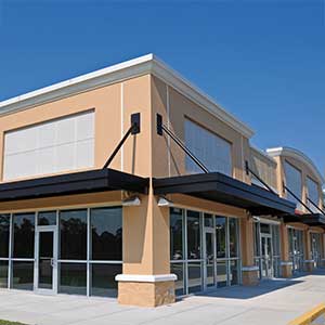 Vacant retail storefront with large windows illustrating commercial property leasing and available retail space.