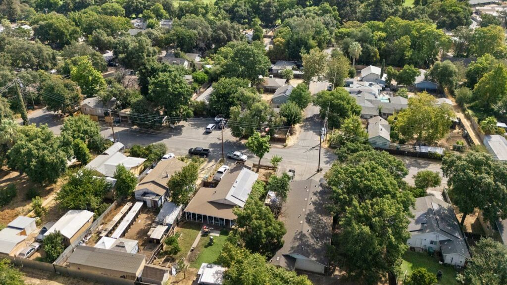 Aerial view of a residential neighborhood in Chico, California, highlighting existing homes and the surrounding area for Chico housing development.