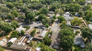 Aerial view of a residential neighborhood in Chico, California, highlighting existing homes and the surrounding area for Chico housing development.