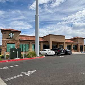 Northern California commercial real estate market featuring a retail shopping center with a Starbucks storefront and parking lot.